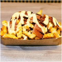 Fries Topped With Bacon And Melted Cheese