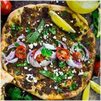 Thin Flatbread Topped With Minced Meat,Cheese,Salads And Sauce Of Choice